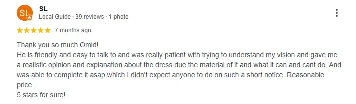 5-star Google review from a Local Guide praising Omid for patient explanations about dress materials and reasonable pricing